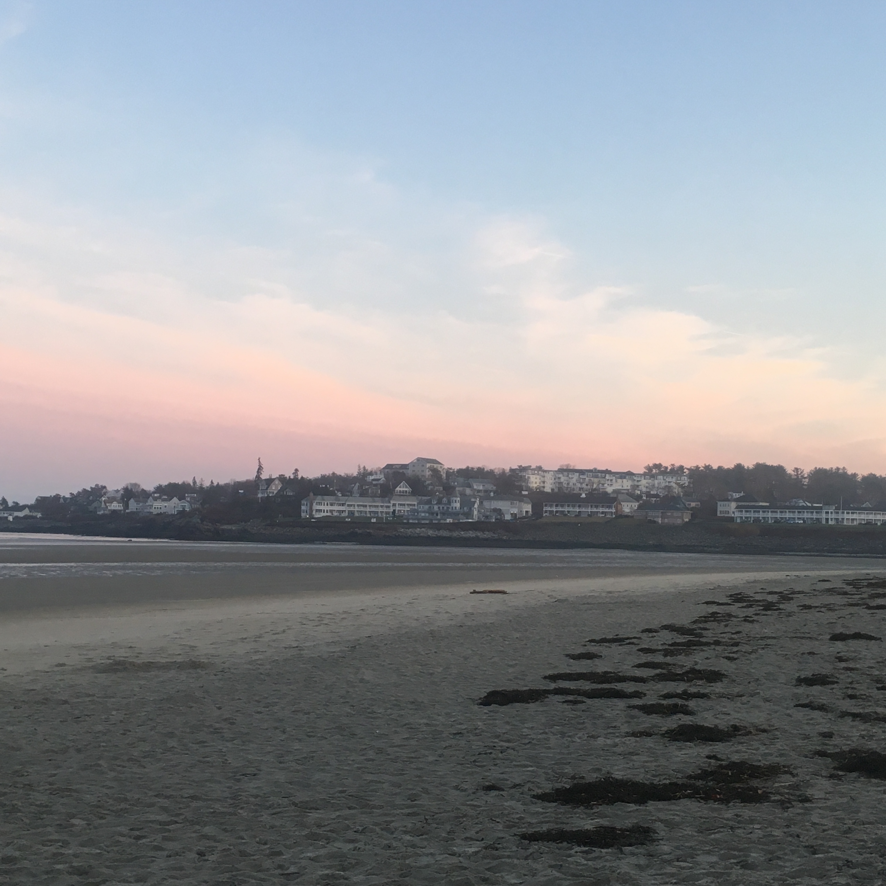 Pink sunset over a beach.