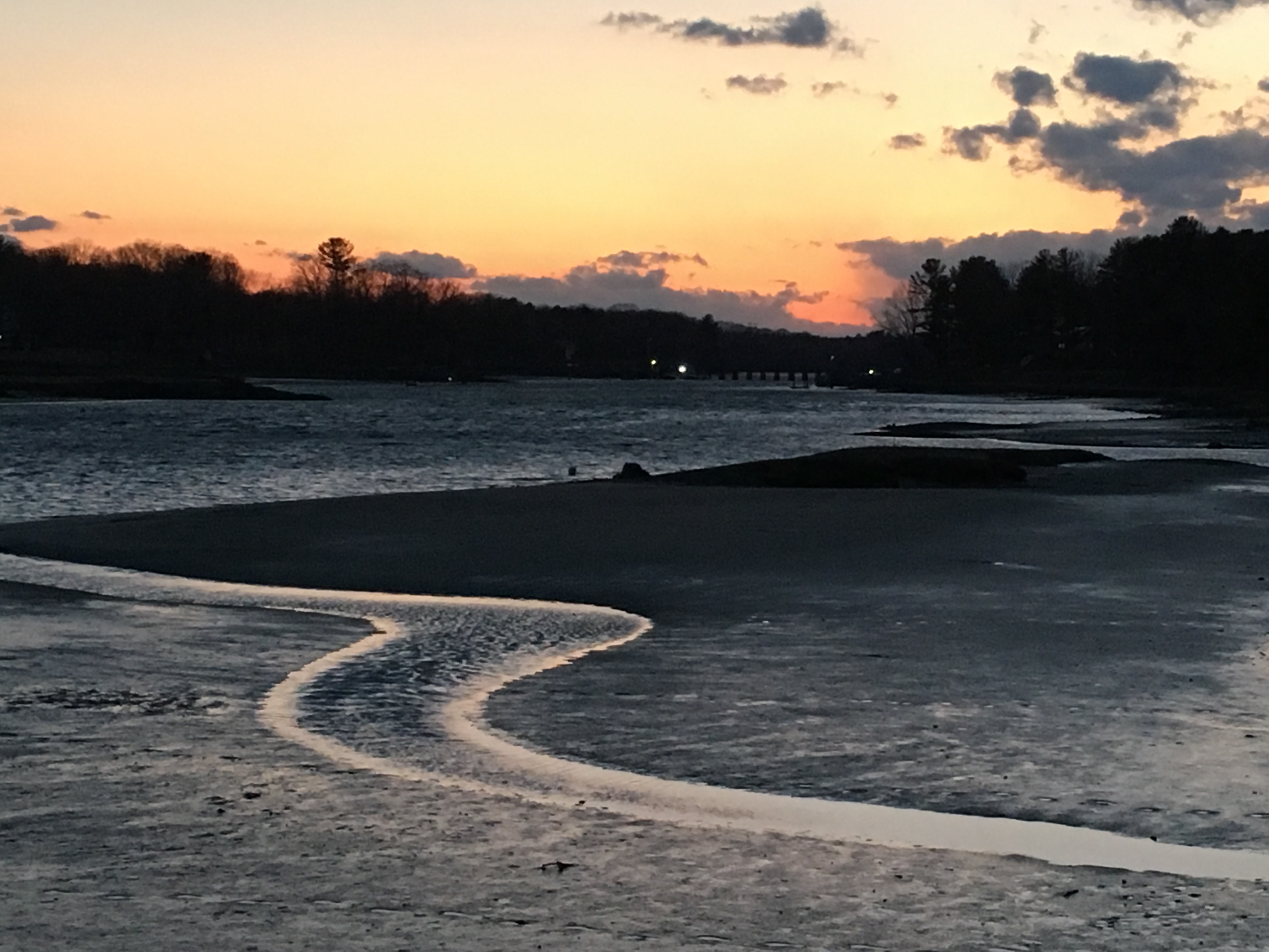 Pink sunset over a river.